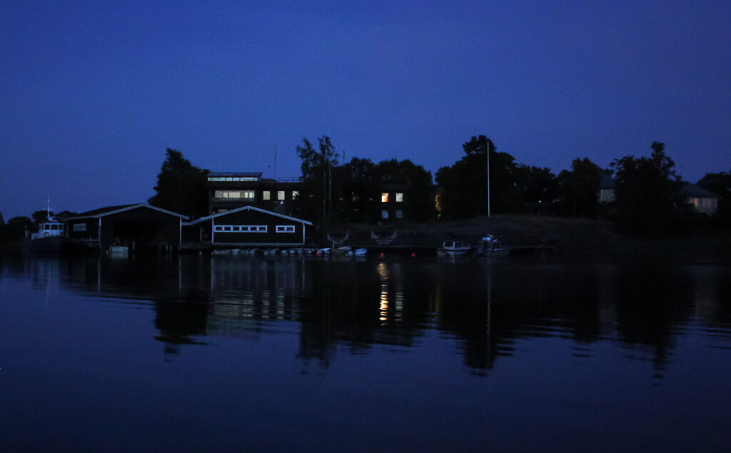 Tvärminne zoological station at night, seen from the sea.